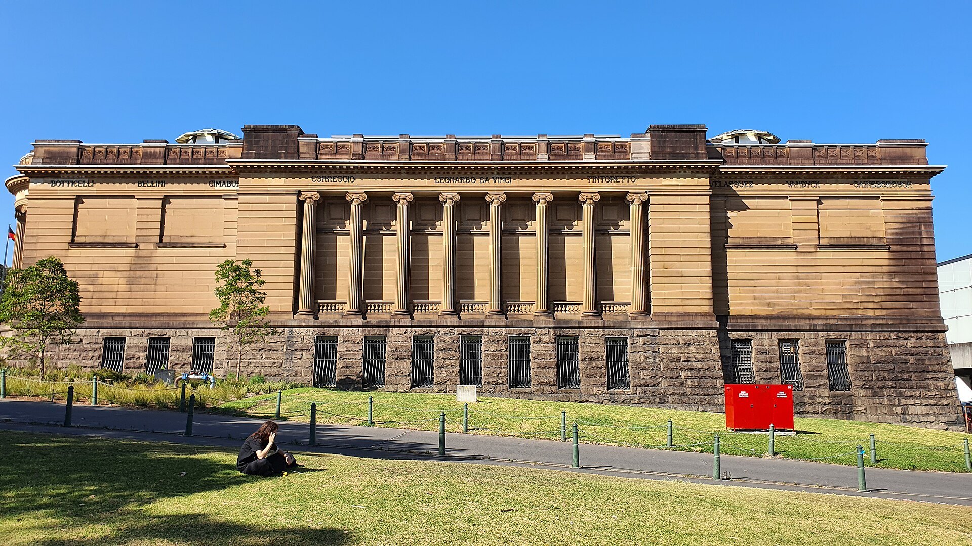 The long sandstone flank of the Art Gallery along the lawn