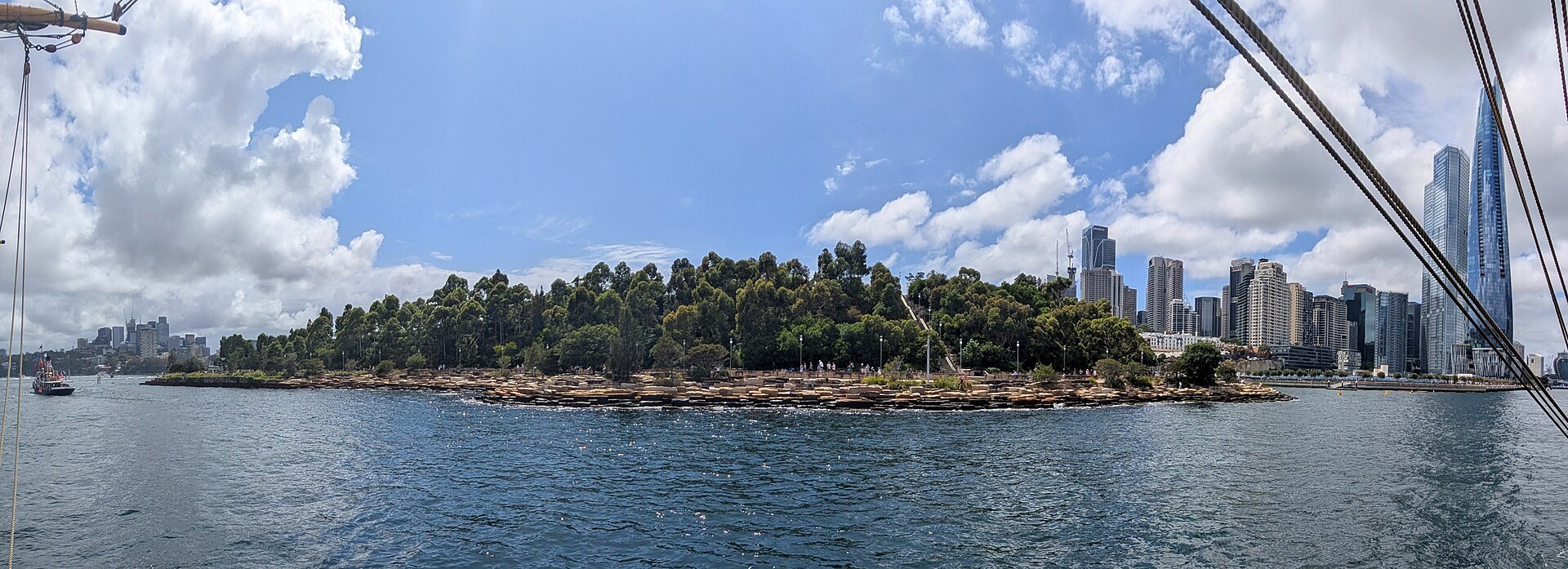 Barangaroo Reserve as a low green headland seen from a passing ferry