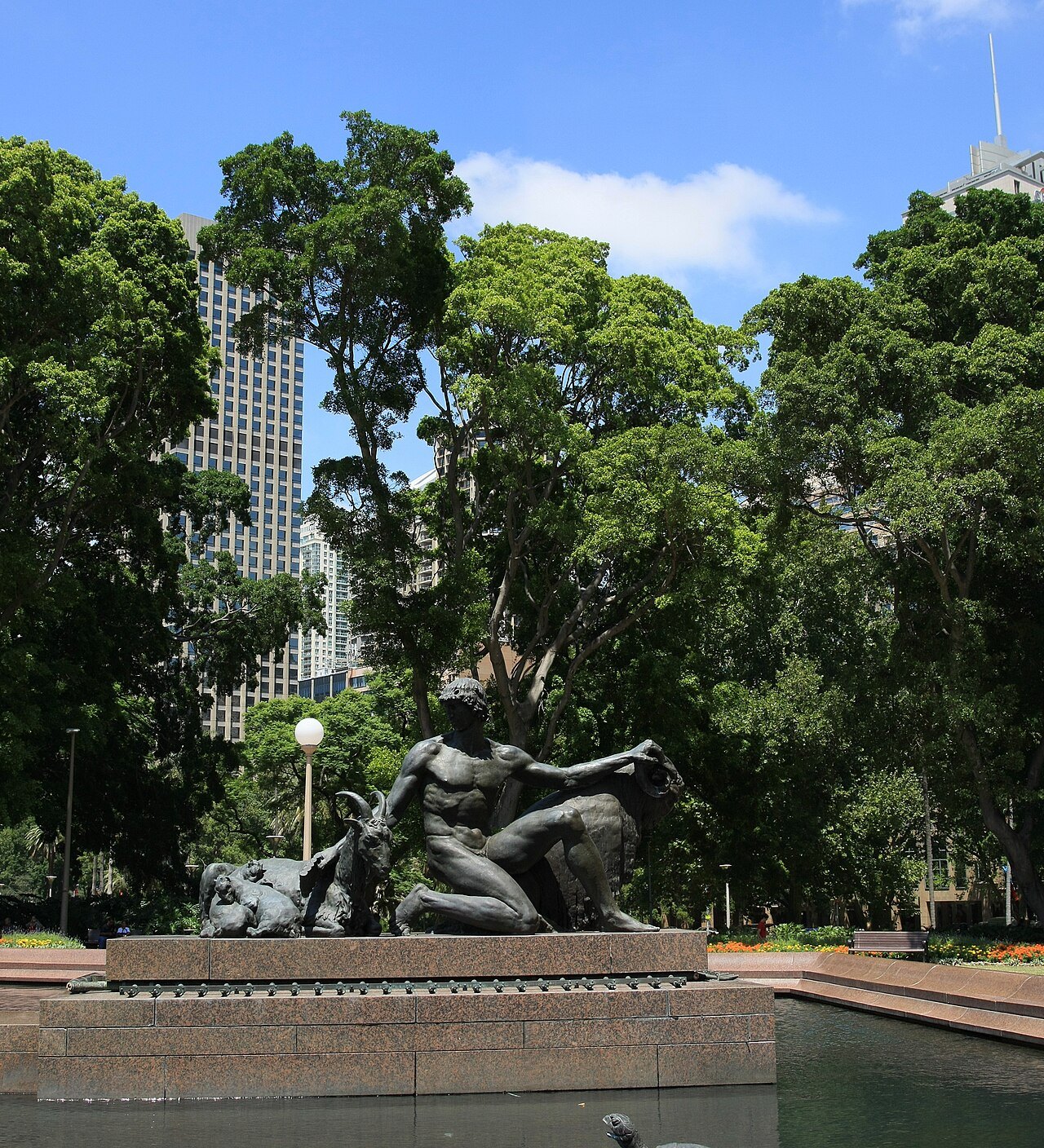 The Archibald Fountain in Hyde Park with the trees of the park behind it