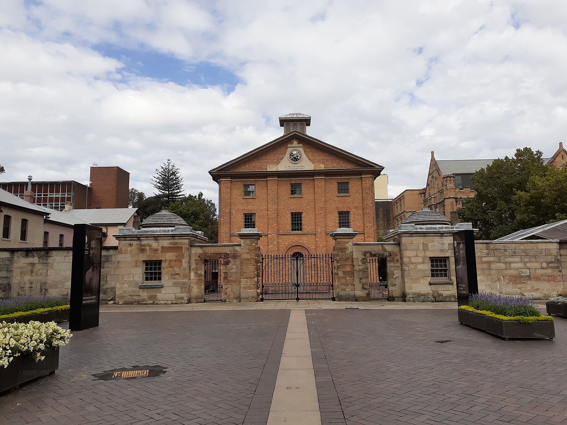 The barracks and its forecourt from the street, the gates open