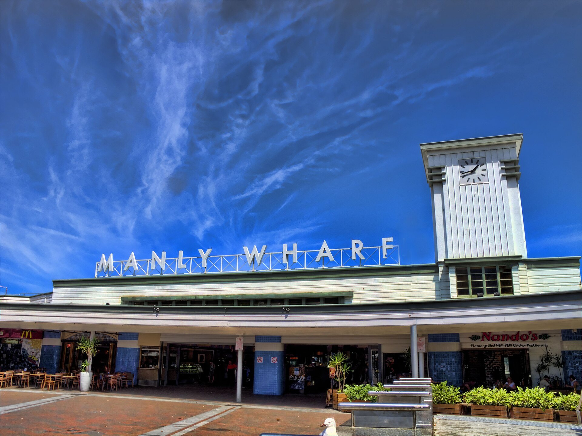 The Manly Wharf building with its lettering against a blue sky