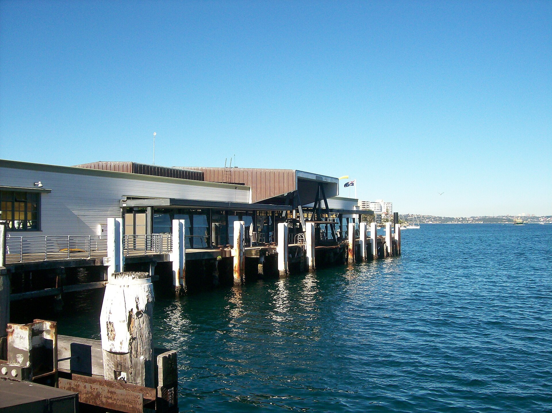 Manly ferry wharf from the side, out over the water on its piles