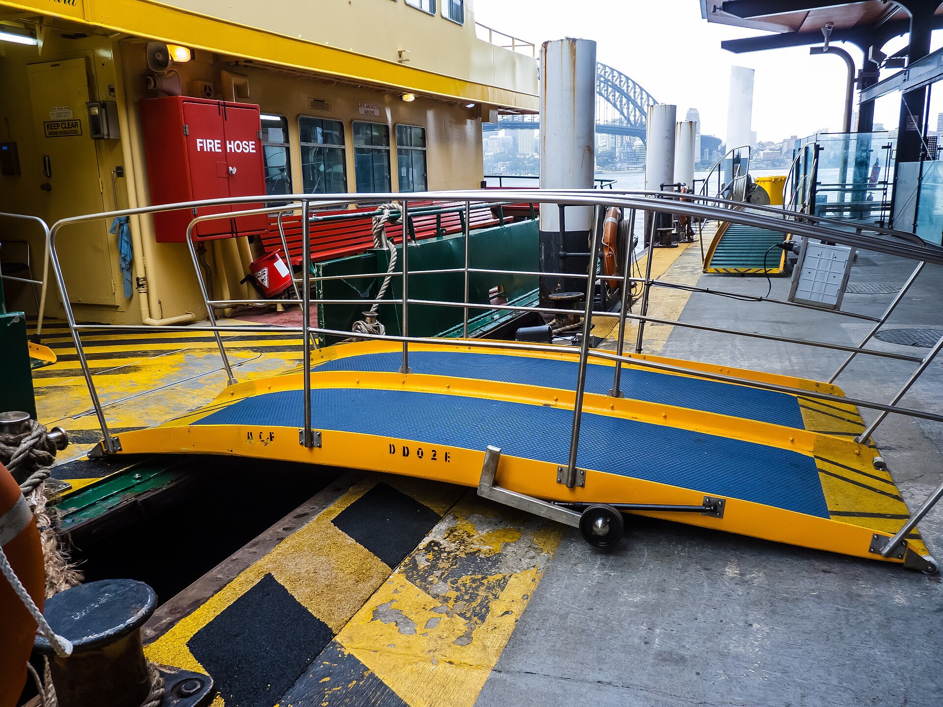 The yellow gangway down to a ferry wharf at Circular Quay