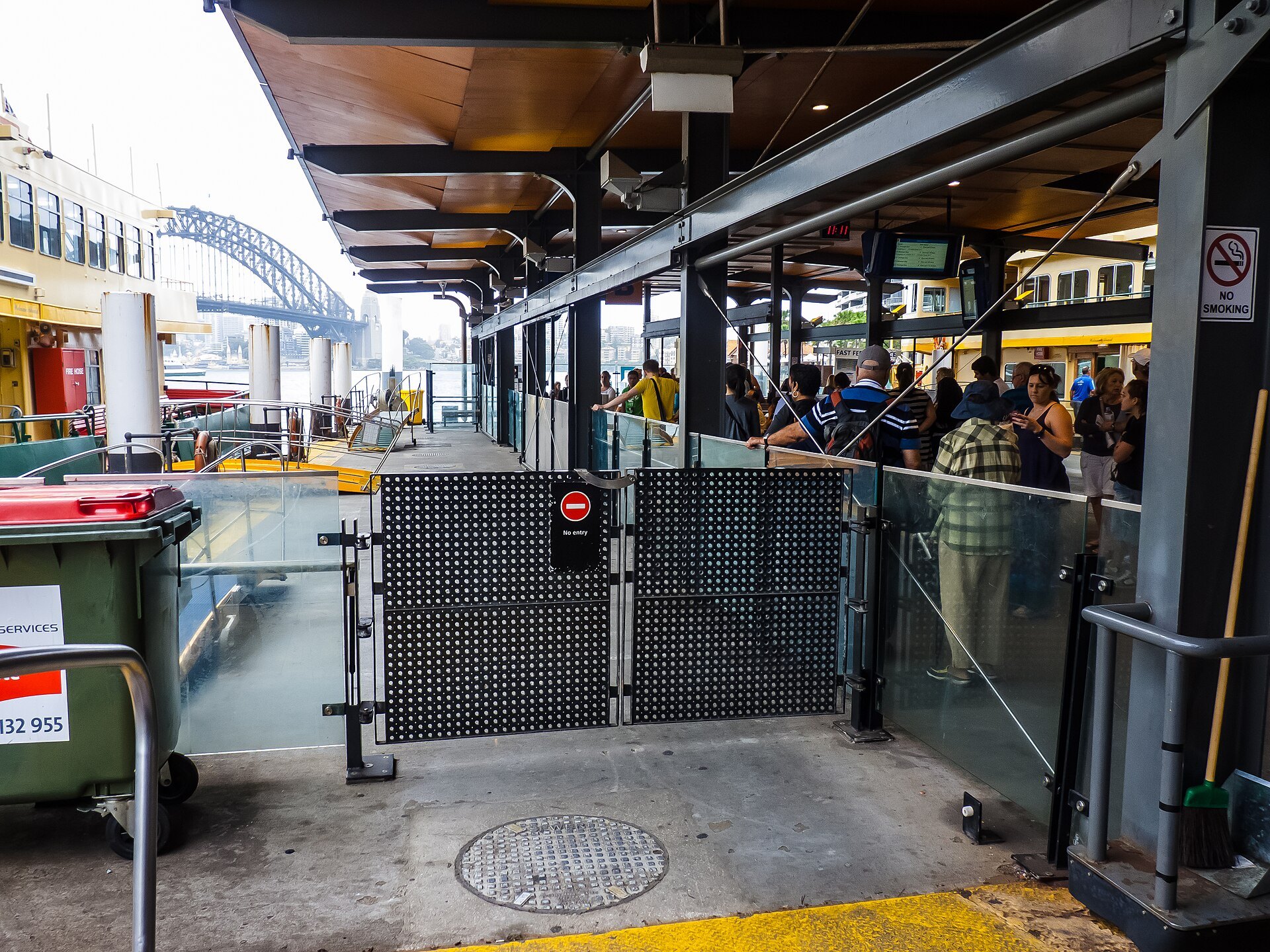 The wharf gates at Circular Quay, with the ferry moored beyond them